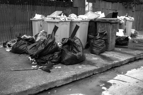 Construction site with builders waste being cleared in Kenton