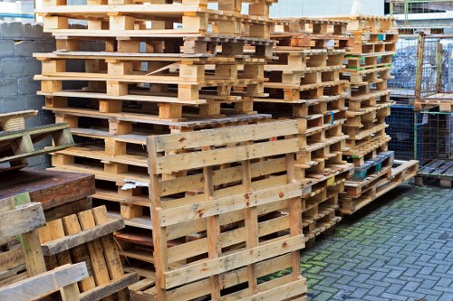 Workers using lifting equipment during commercial clearance